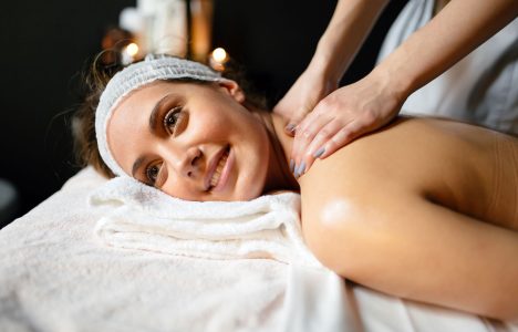 beautiful-young-and-cute-woman-enjoying-massage-UZ97GDC.jpg